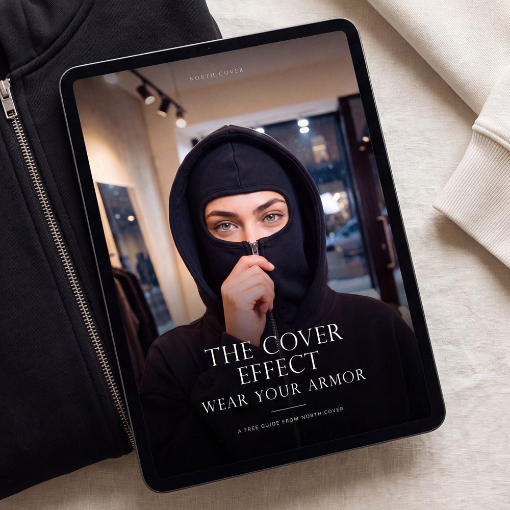 The Cover Effect eBook shown on a tablet resting on a black North Cover hoodie